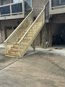 A wooden stair on the outside of a building
