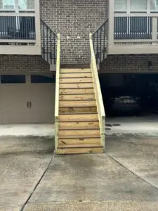 A wooden stair on the outside of a building